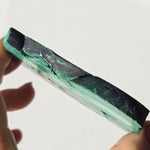 Arfvedsonite plate with a malachite slice