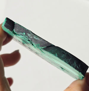 Arfvedsonite plate with a malachite slice