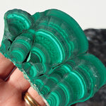 Arfvedsonite plate with a malachite slice