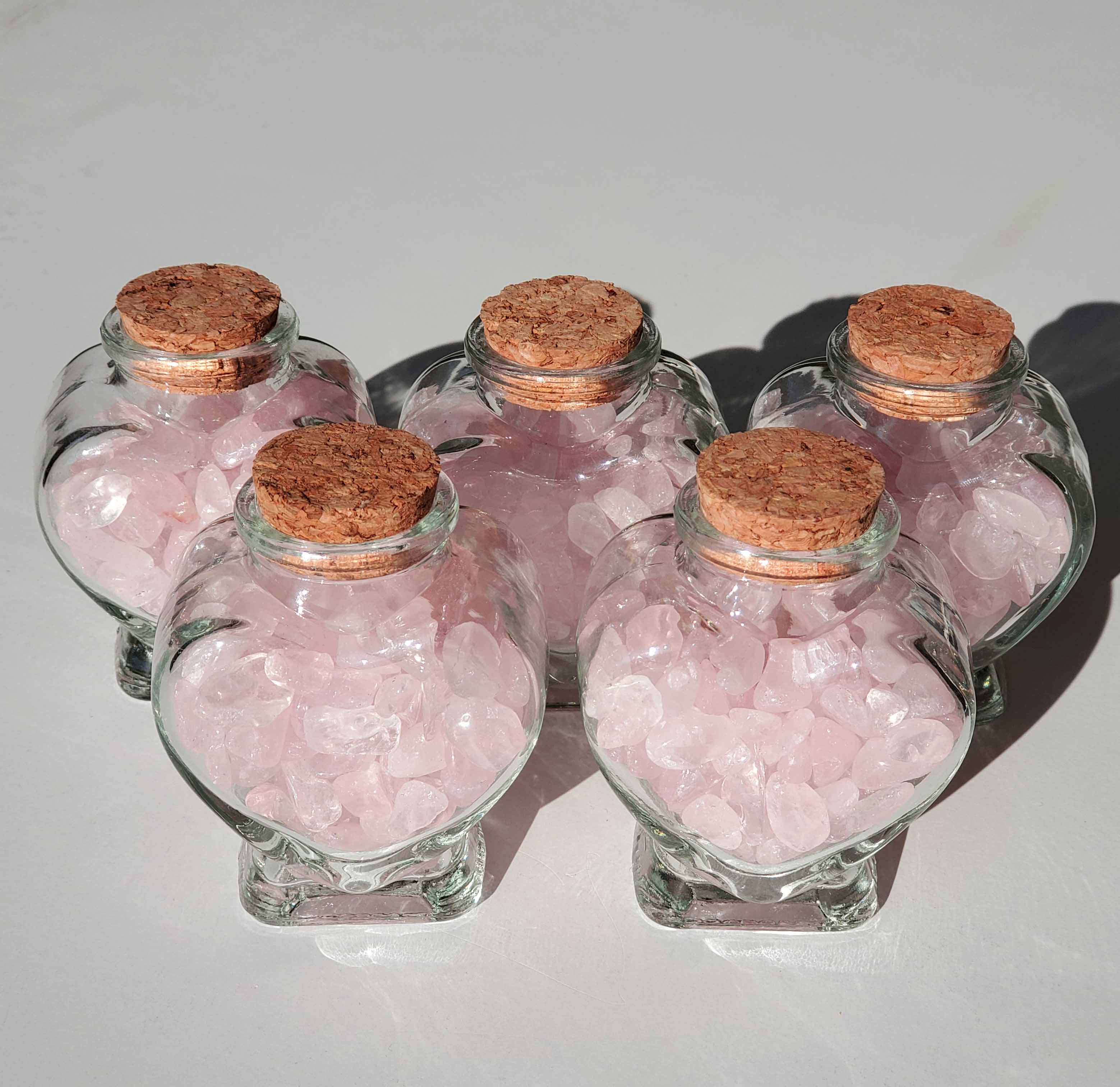 Rose Quartz Chips in a glass heart bottle