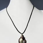 Flashy Ammonite necklace adorned with an amethyst bead