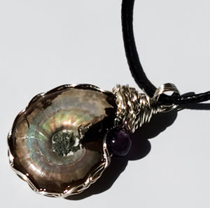 Flashy Ammonite necklace adorned with an amethyst bead