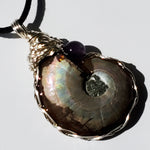 Flashy Ammonite necklace adorned with an amethyst bead